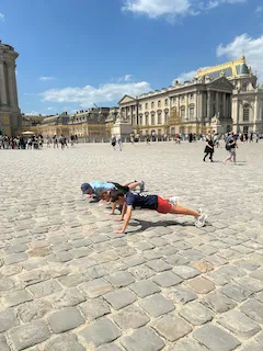 Doing pushups at the Palace of Versailles